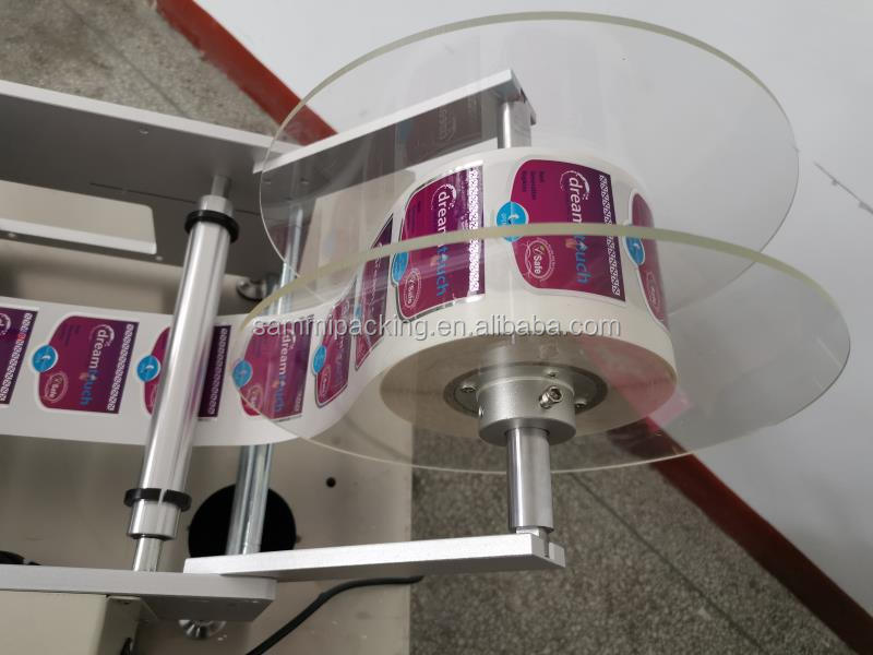 أحدث آلة لصق الملصقات ذاتية اللصق شبه الأوتوماتيكية على الوجهين لزجاجات PET البلاستيكية المستديرة