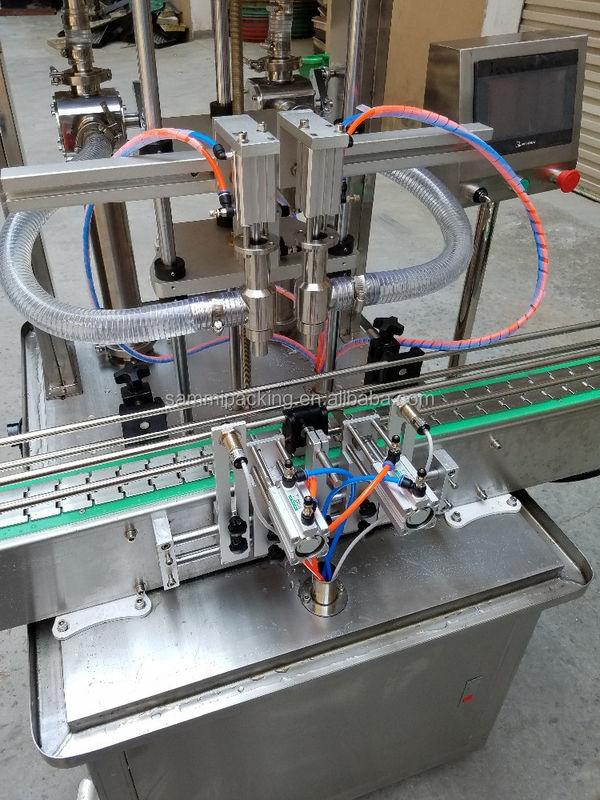 آلة تعبئة صلصة زبدة الفول السوداني الأوتوماتيكية عالية الجودة، حبيبية، معجون لزج، عصير، زيت للزيوت والمشروبات في زجاجات سعة 500 مل